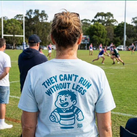 Lady at rugby league game wearing a footy head shirt 'Can't Run Without Legs!'